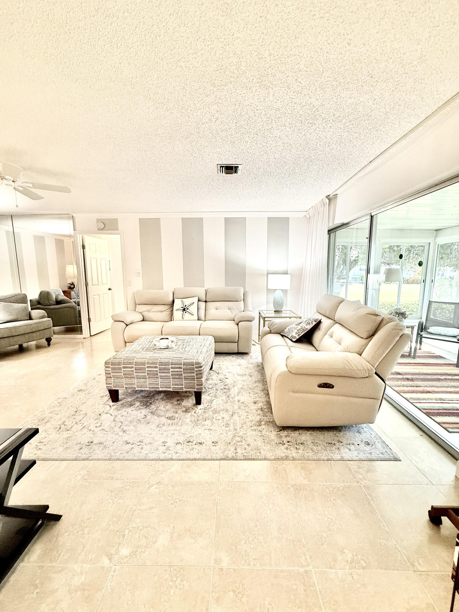 828 Timberview Drive, Unit D Fort Pierce, FL 34982 - Photo 8 of 28 a living room with furniture and a large window