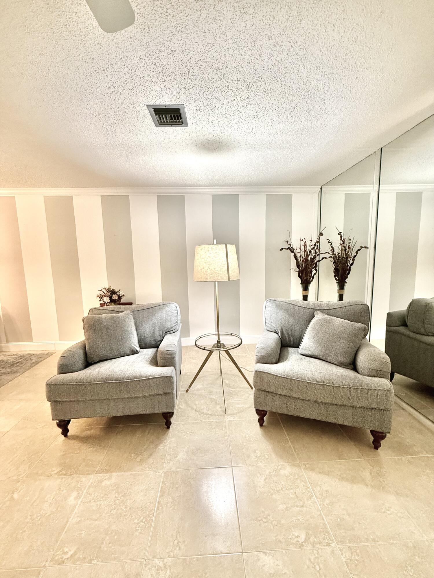 828 Timberview Drive, Unit D Fort Pierce, FL 34982 - Photo 10 of 28 a living room with furniture and a large window