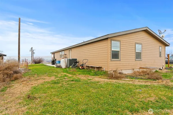 a view of a backyard of the house