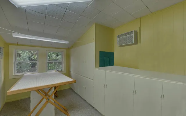 a view of a workspace with furniture