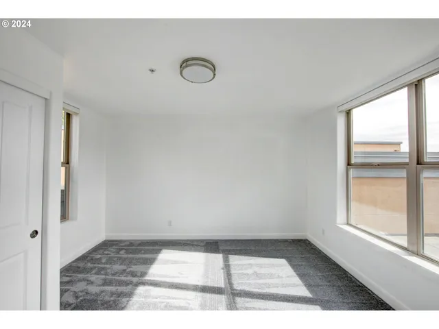 a view of an empty room and window