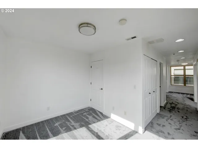 a view of a livingroom with wooden floor