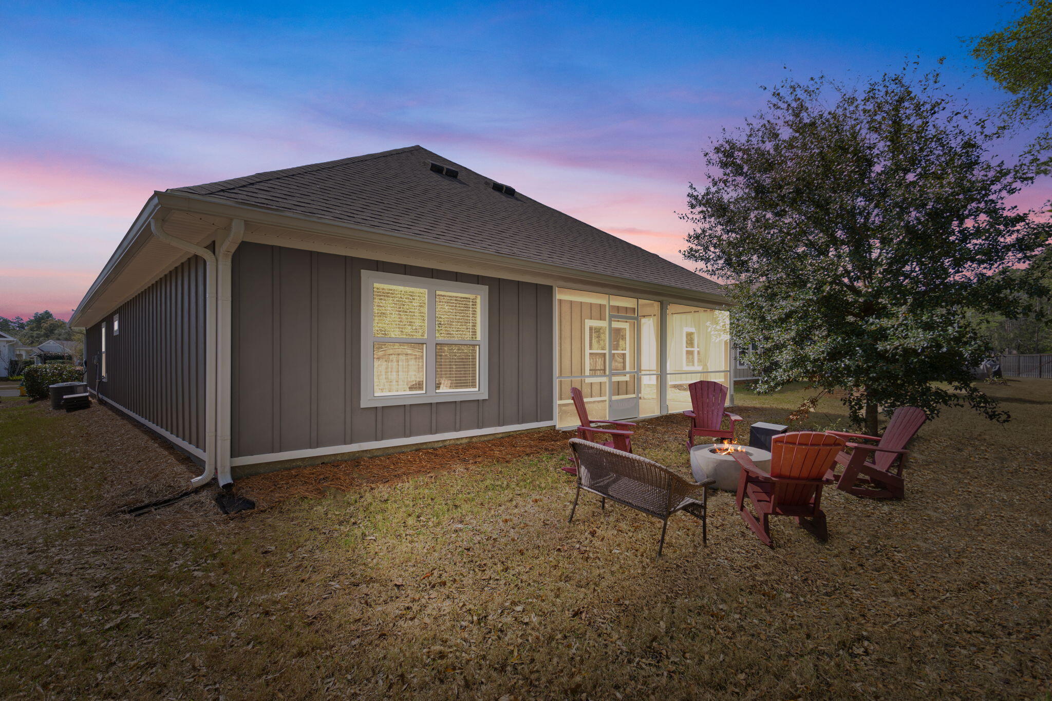 371 Lightning Bug Lane Freeport, FL 32439 - Photo 25 of 53 a backyard of a house with table and chairs