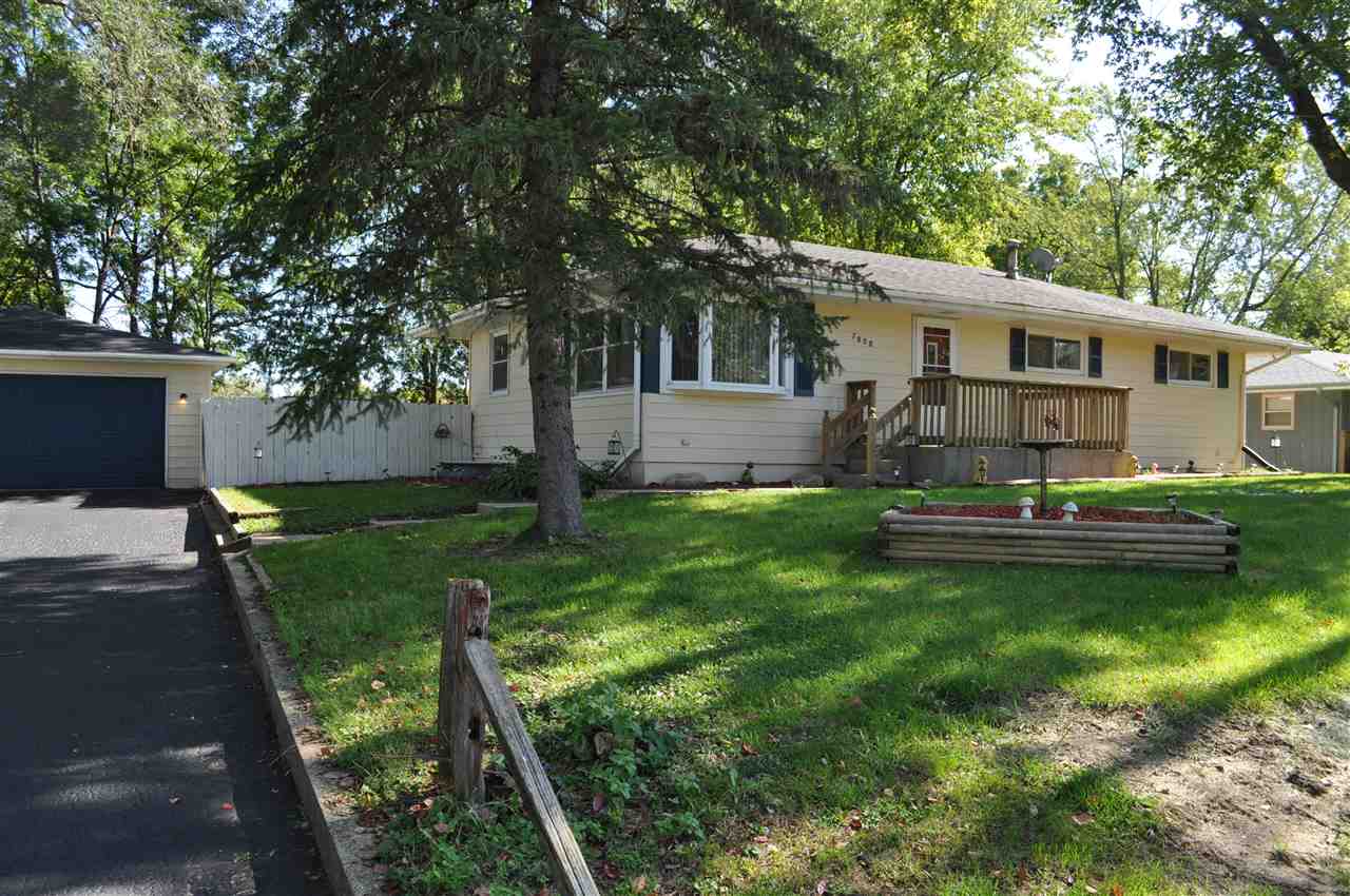 7050 Ralph Road Rockford, IL 61109 - Photo 1 of 9 a front view of a house with garden
