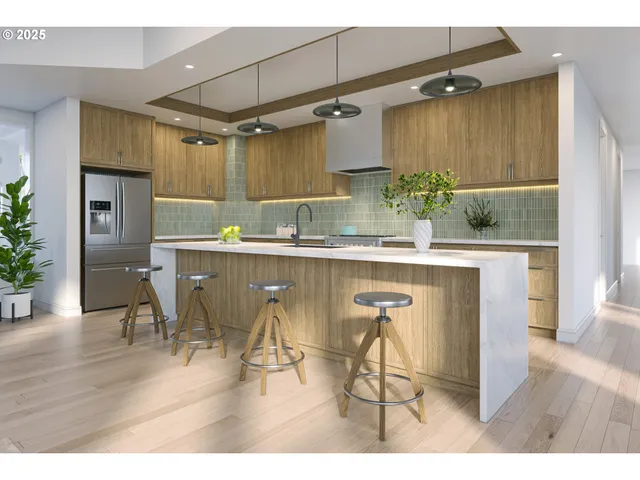 a kitchen with stainless steel appliances kitchen island a table chairs in it and wooden floor