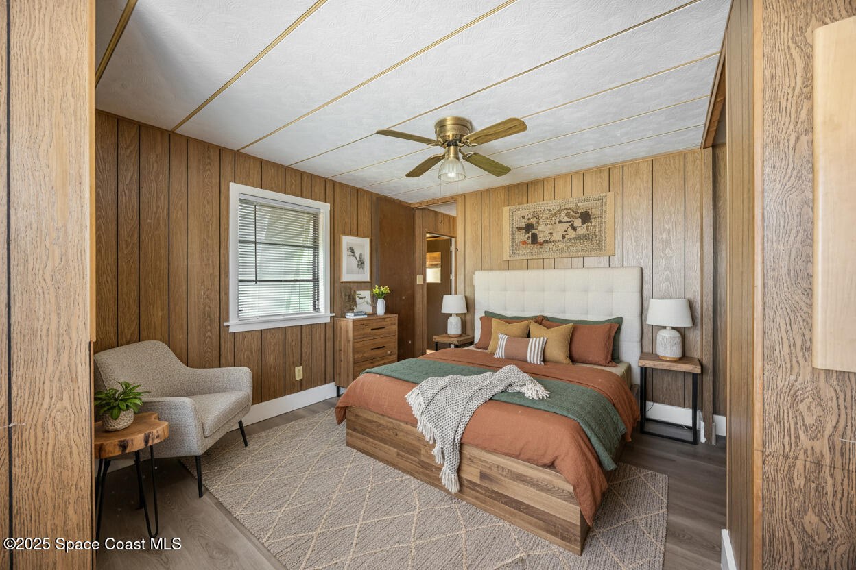 4895 Orange Street Mims, FL 32754 - Photo 11 of 33 a bedroom with a bed and window