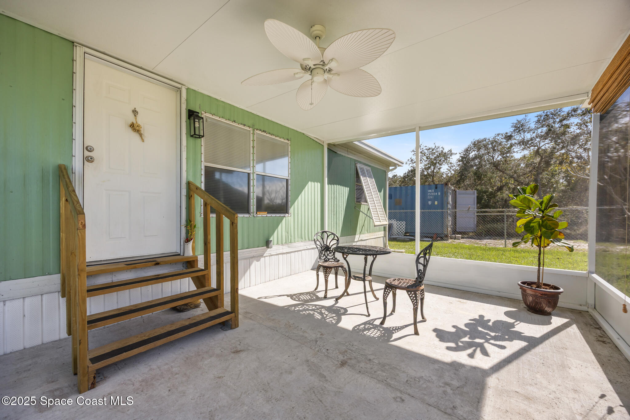 4895 Orange Street Mims, FL 32754 - Photo 15 of 33 a living room with furniture and a large window