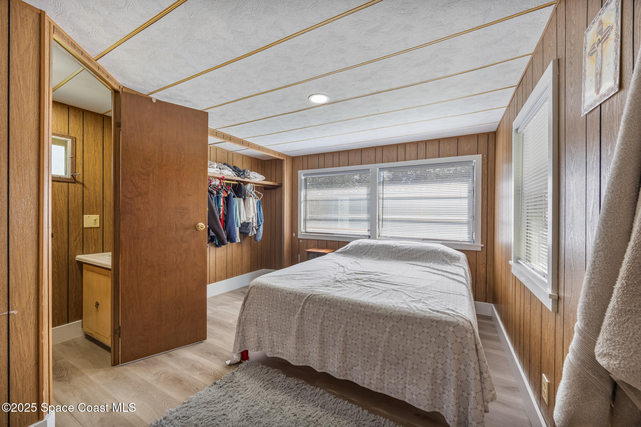 4895 Orange Street Mims, FL 32754 - Photo 17 of 33 a bedroom with a bed and a dresser