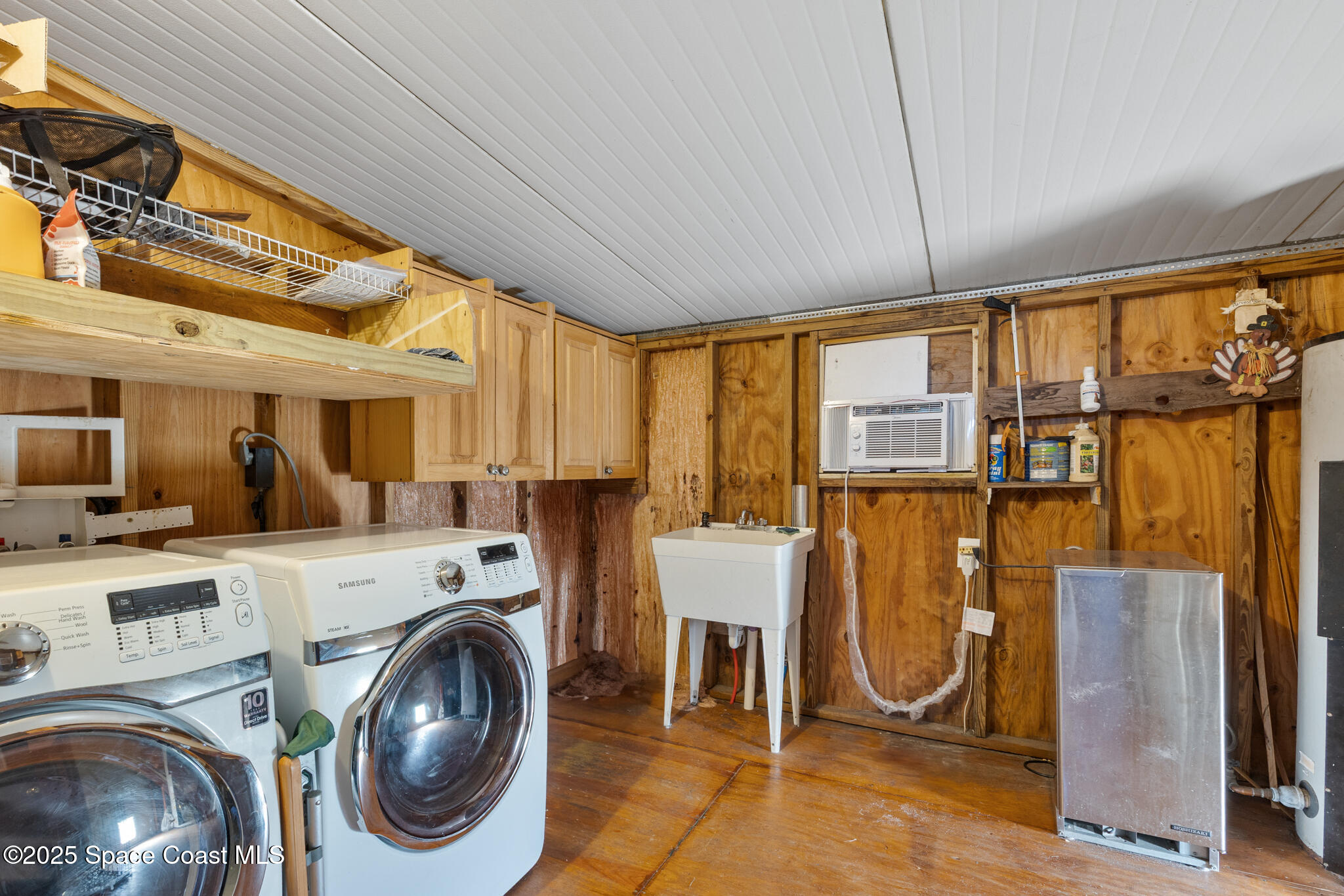 4895 Orange Street Mims, FL 32754 - Photo 20 of 33 a view of a kitchen with furniture and a fireplace
