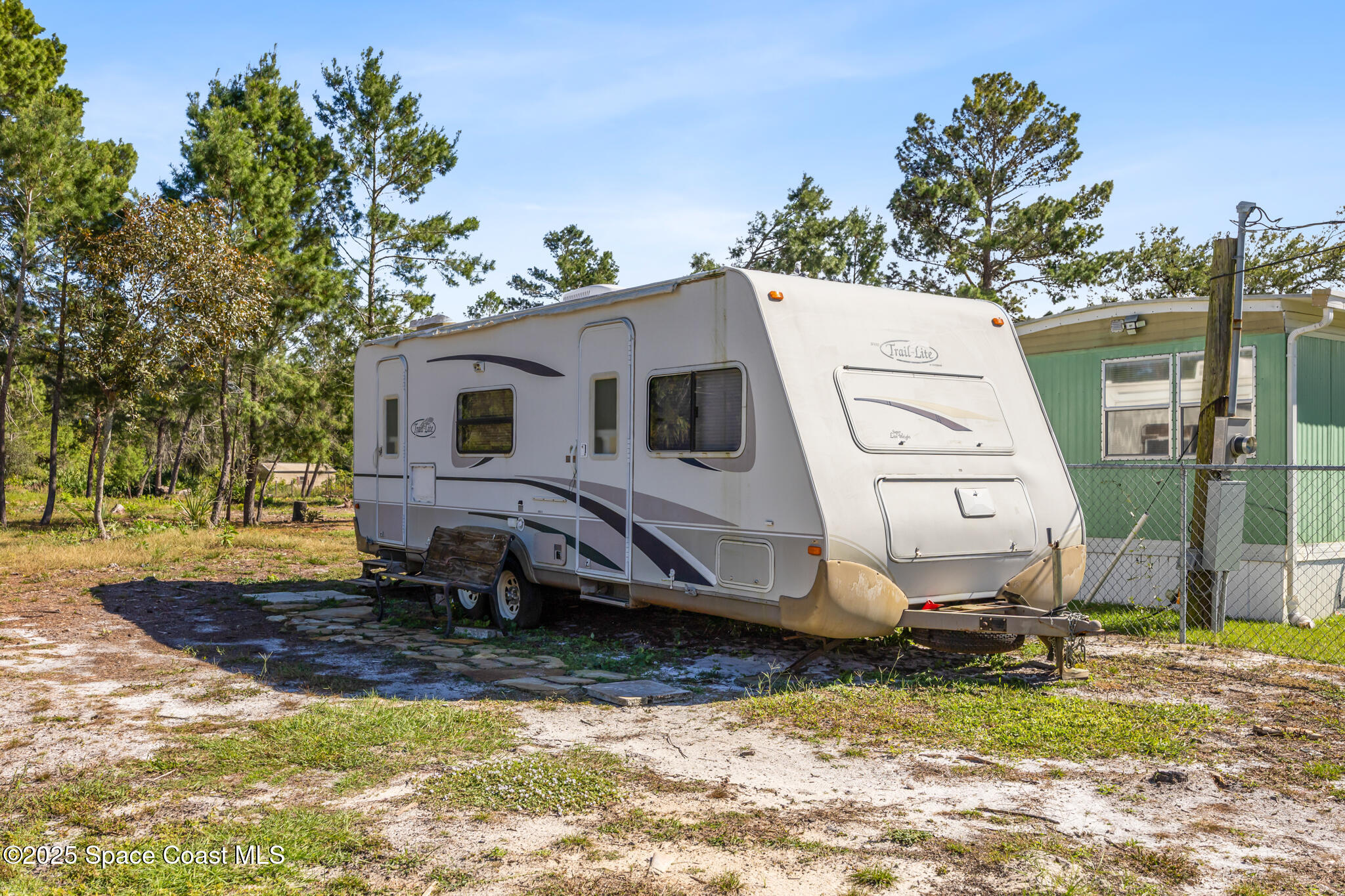 4895 Orange Street Mims, FL 32754 - Photo 21 of 33 a view of a house with a yard