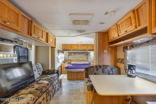 a outdoor space with furniture and view of living room
