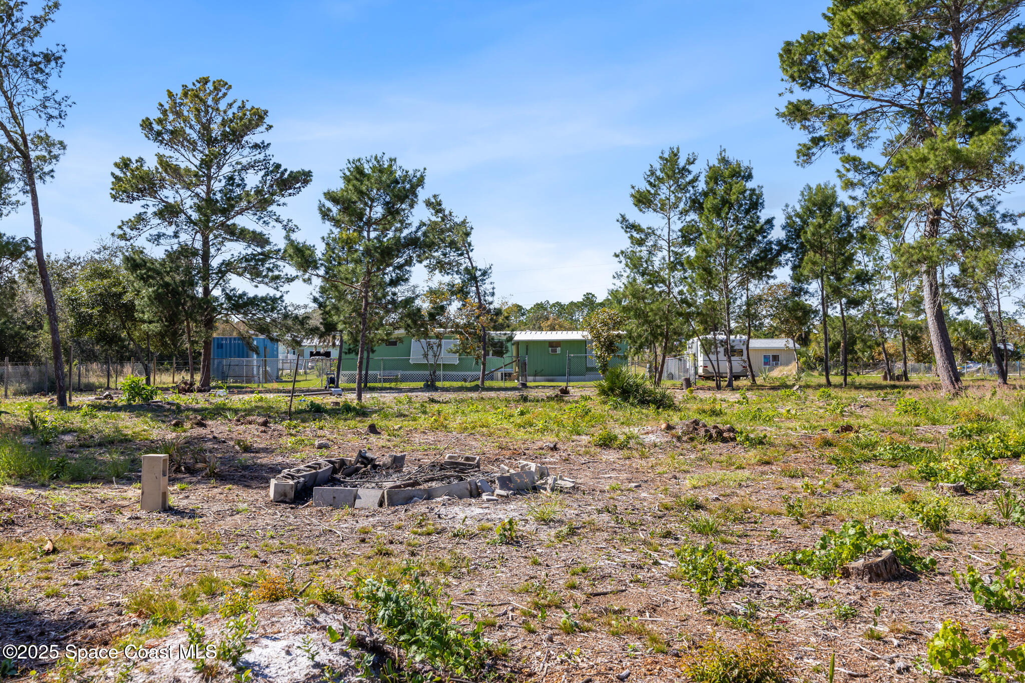 4895 Orange Street Mims, FL 32754 - Photo 28 of 33 a view of a yard with swimming pool