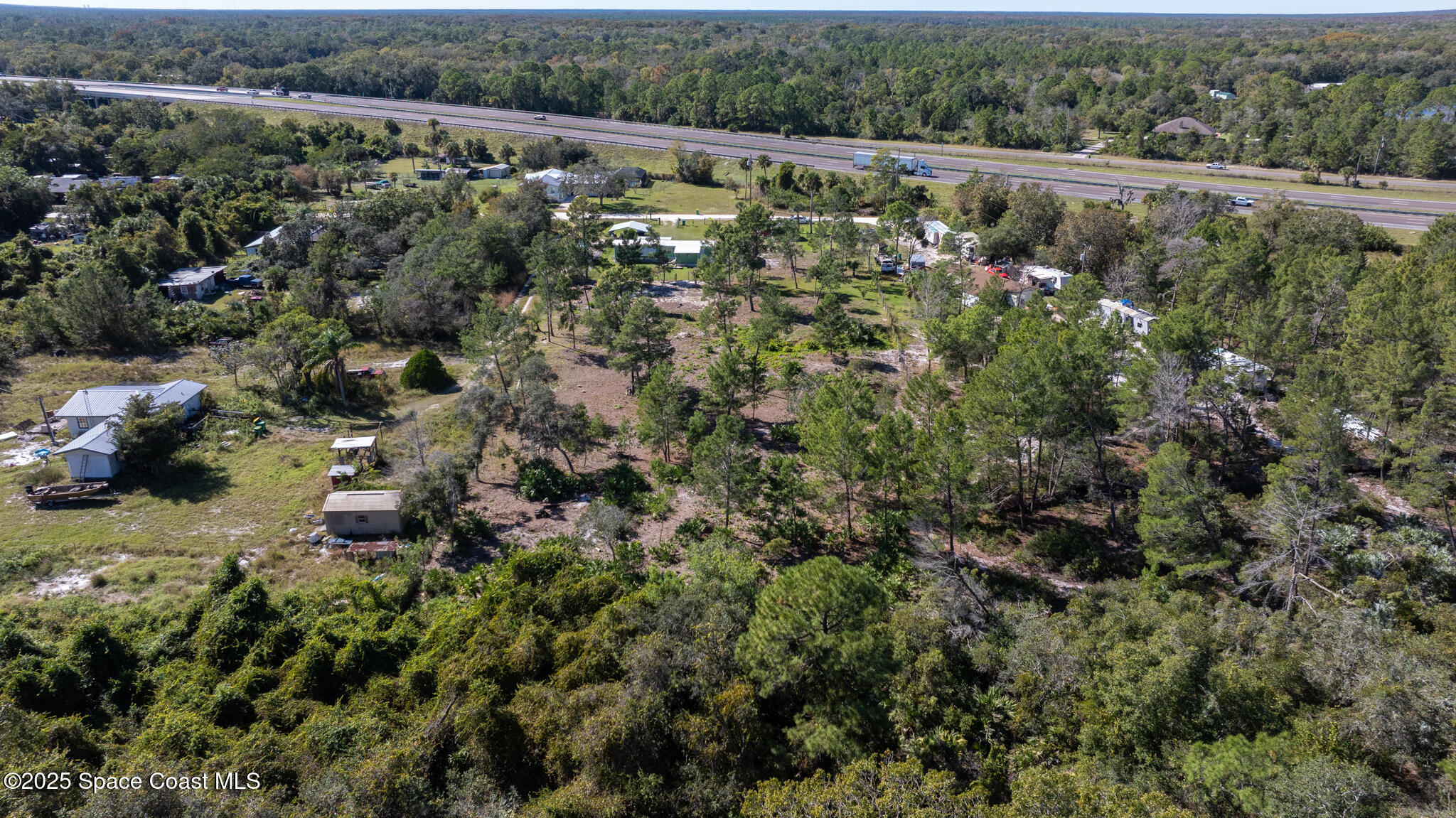 4895 Orange Street Mims, FL 32754 - Photo 33 of 33 a view of a city with lush green forest
