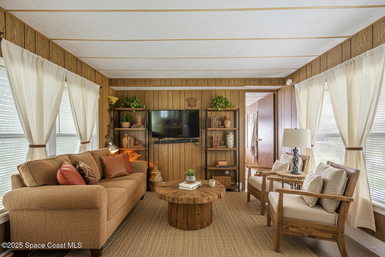 4895 Orange Street Mims, FL 32754 - Photo 9 of 33 a living room with furniture and a large window