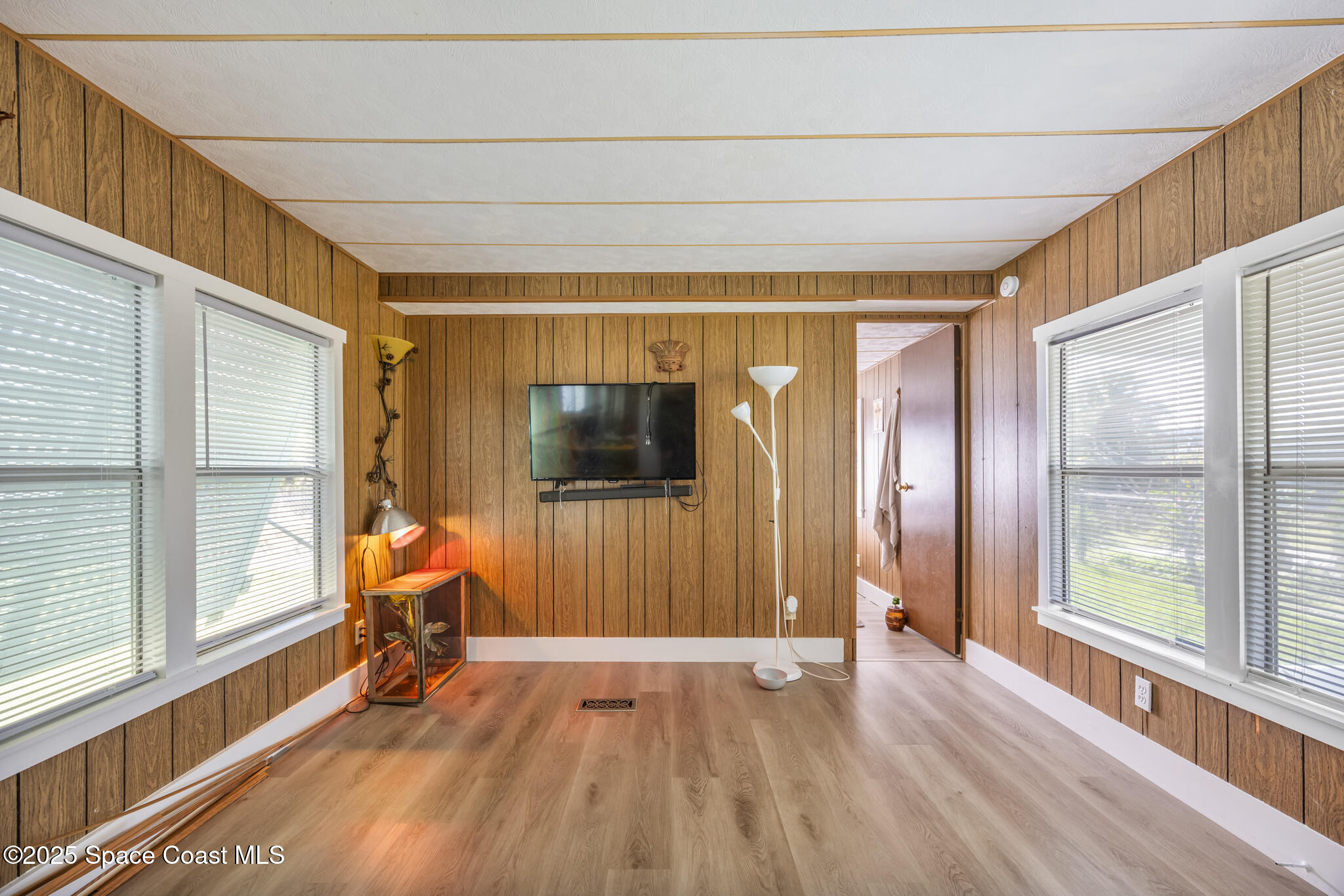 4895 Orange Street Mims, FL 32754 - Photo 10 of 33 a view of empty room with wooden floor and fan