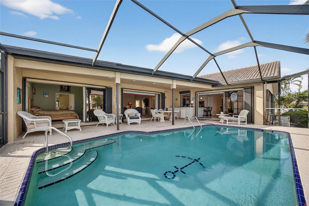 4075 Turtle Dove Circle Punta Gorda, FL 33950 - Photo 3 of 43 a view of a swimming pool with outdoor seating