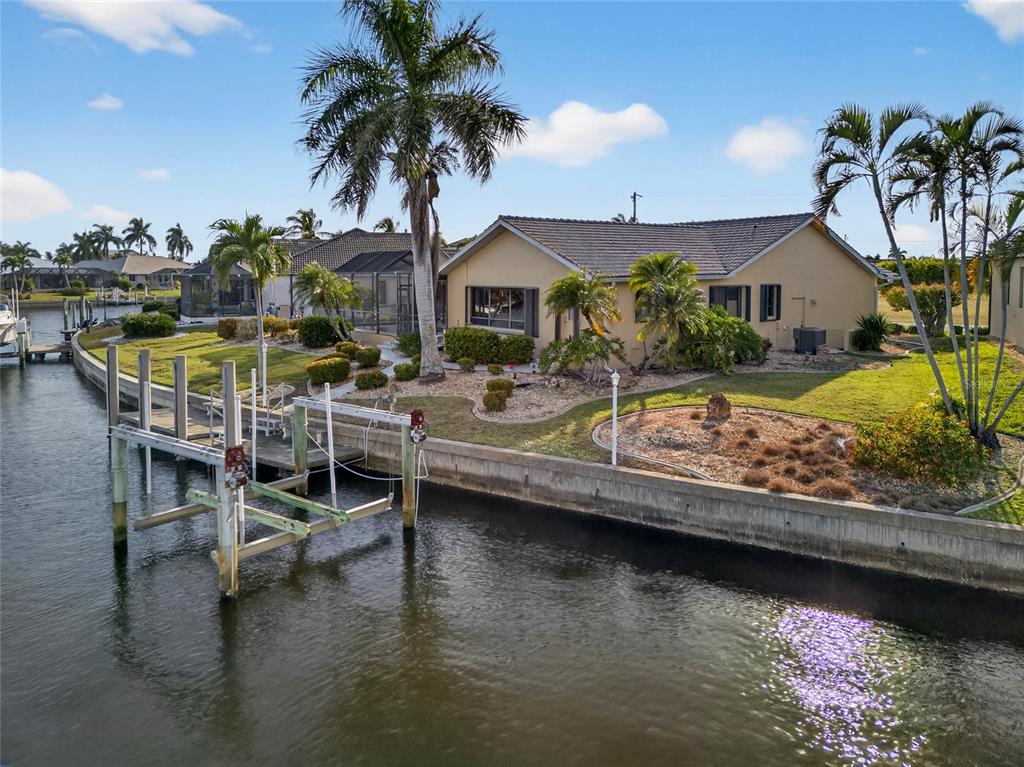 4075 Turtle Dove Circle Punta Gorda, FL 33950 - Photo 35 of 43 a view of house with swimming pool and a yard