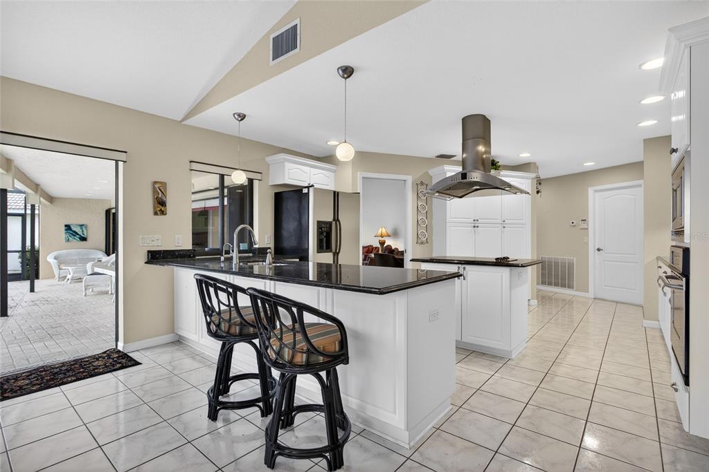 4075 Turtle Dove Circle Punta Gorda, FL 33950 - Photo 10 of 43 a kitchen with stainless steel appliances a table and chairs in it