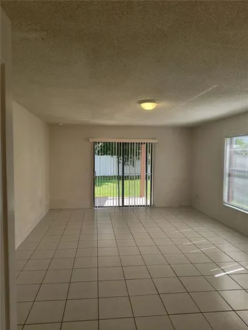 a bathroom with a granite countertop toilet and a shower
