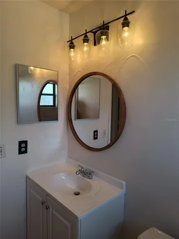 a view of an empty room and a window