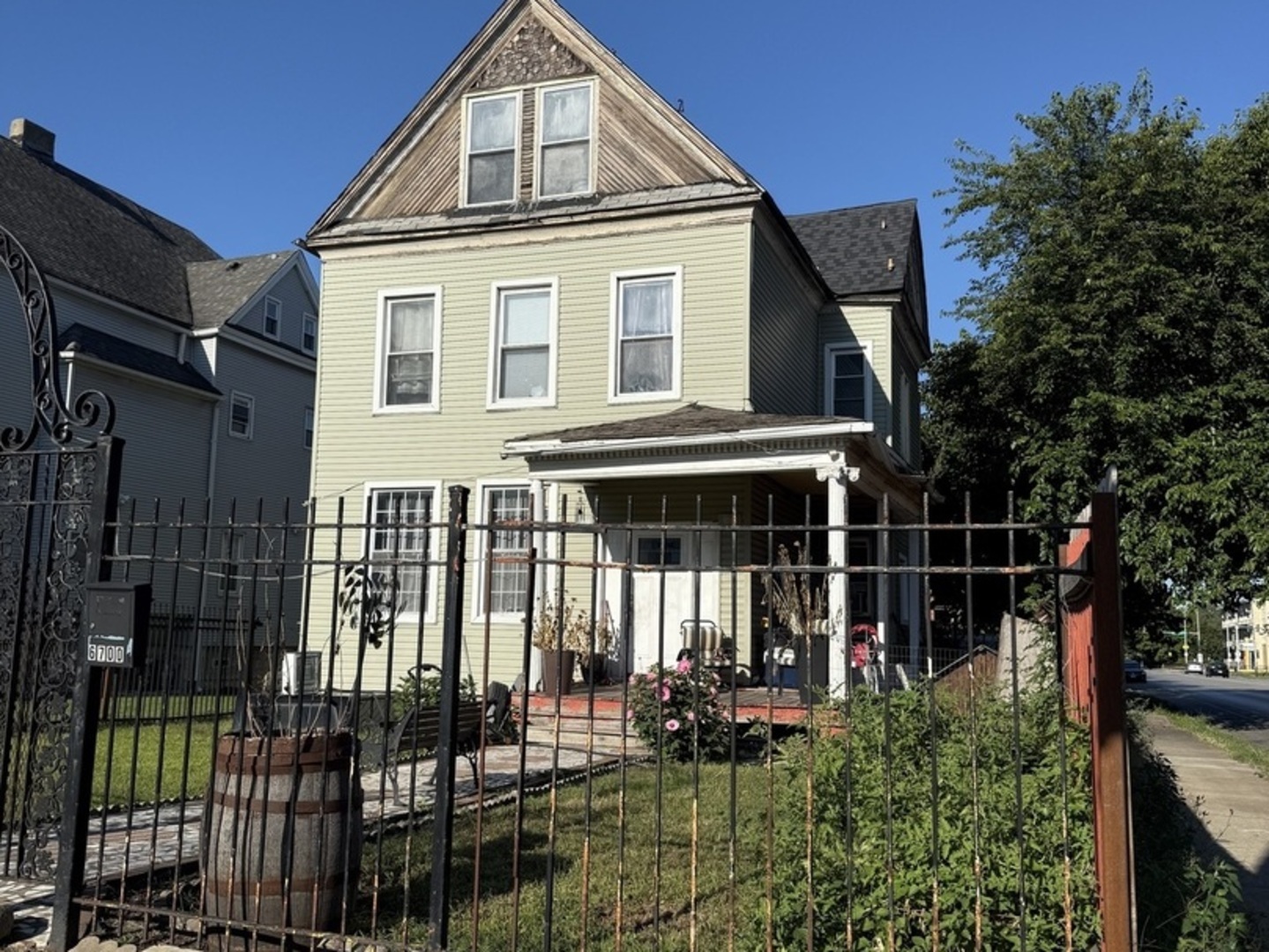 6700 South Stewart Avenue Chicago, IL 60621 - Photo 1 of 1 a front view of a house with balcony