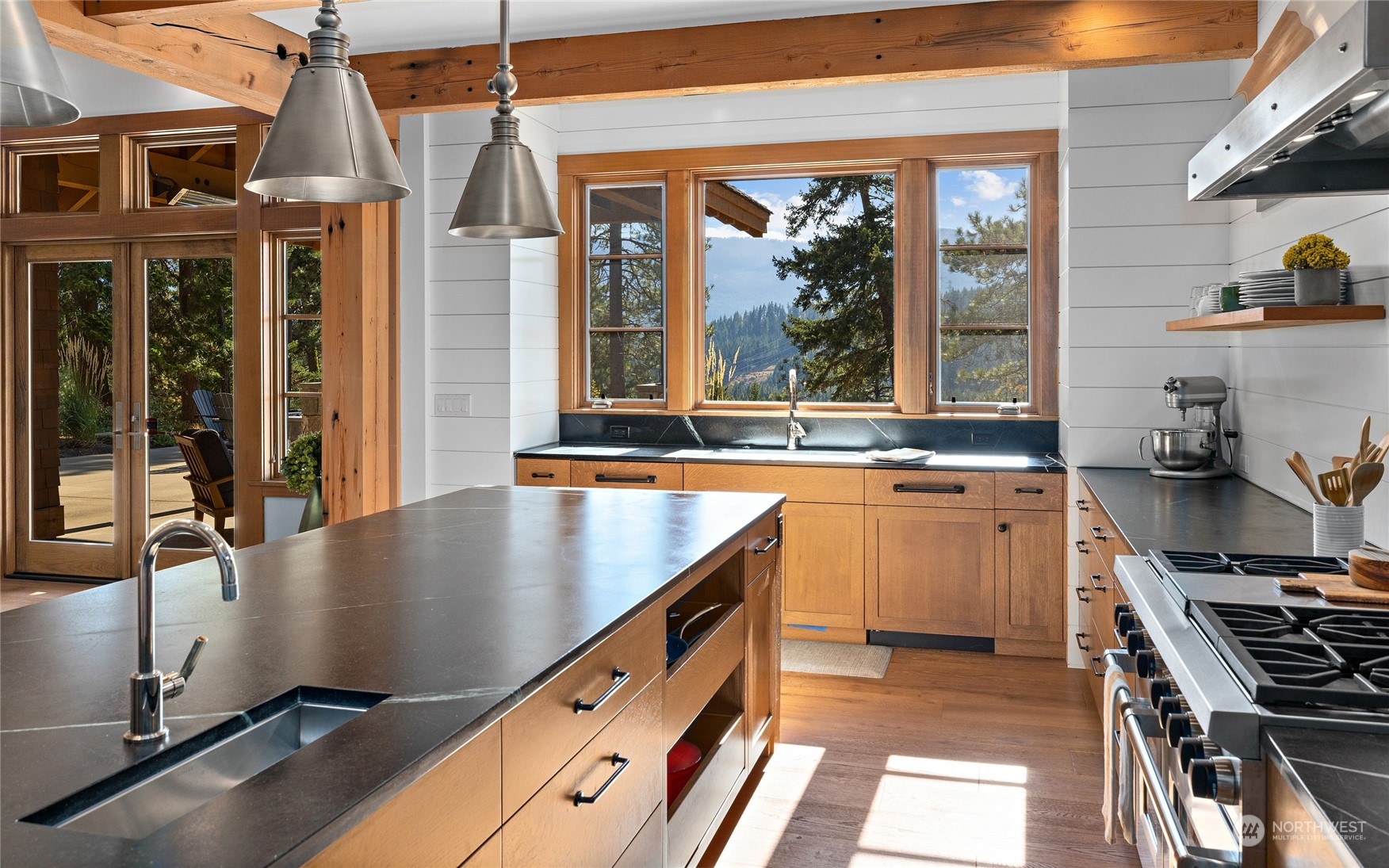 1040 Pinegrass Loop Cle Elum, WA 98922 - Photo 11 of 39 a kitchen with stainless steel appliances granite countertop a sink a stove and a wooden floors