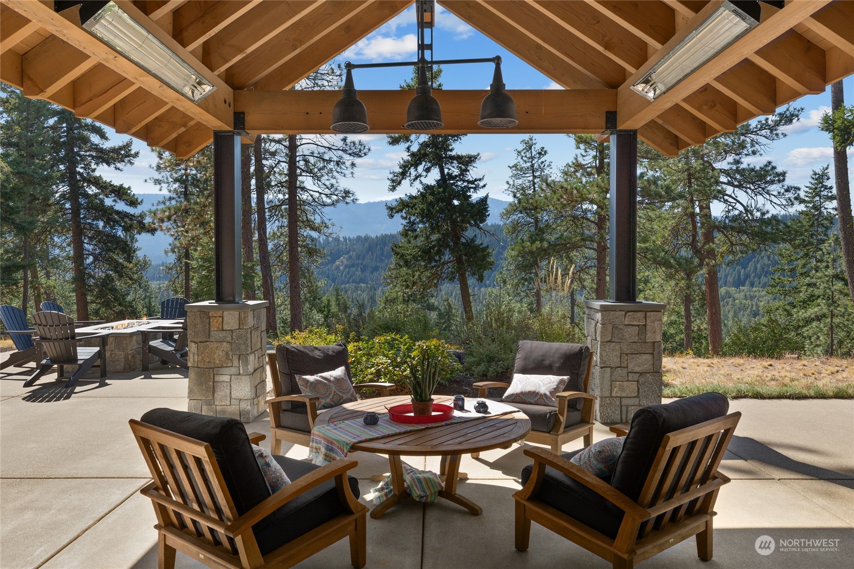 1040 Pinegrass Loop Cle Elum, WA 98922 - Photo 13 of 39 a view of a patio with a table chairs and a backyard