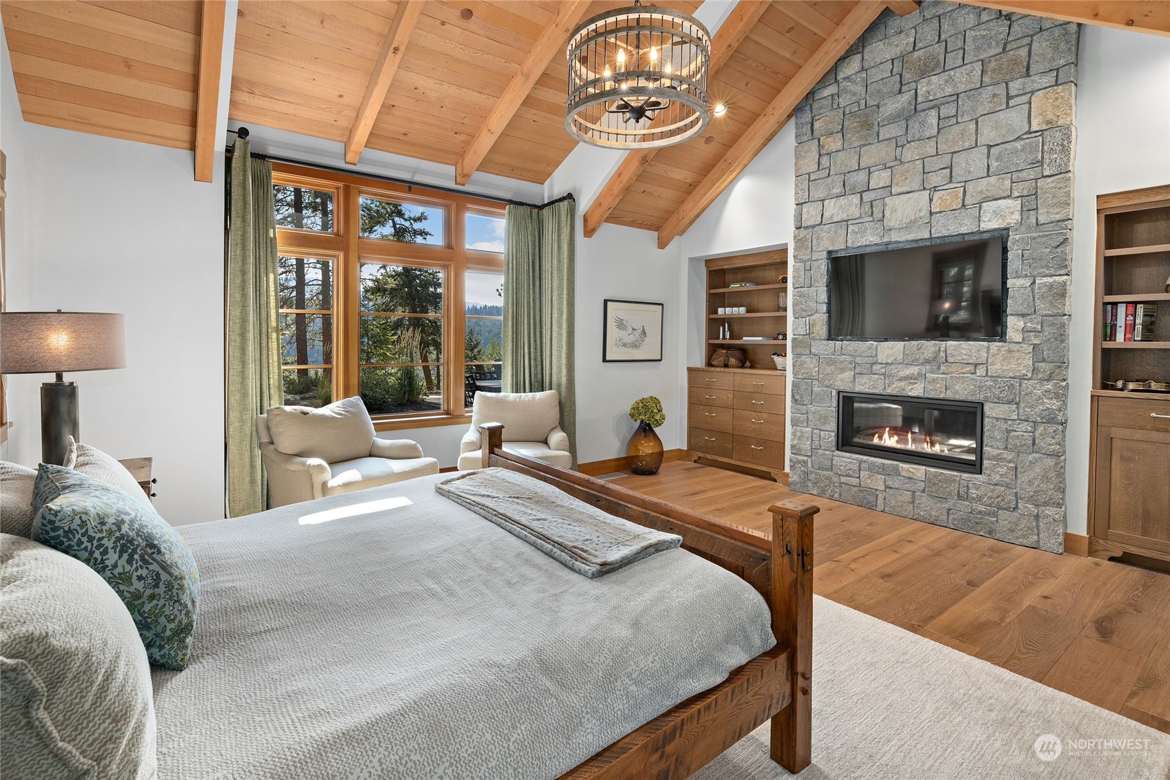 1040 Pinegrass Loop Cle Elum, WA 98922 - Photo 21 of 39 a bedroom with a bed and a fireplace