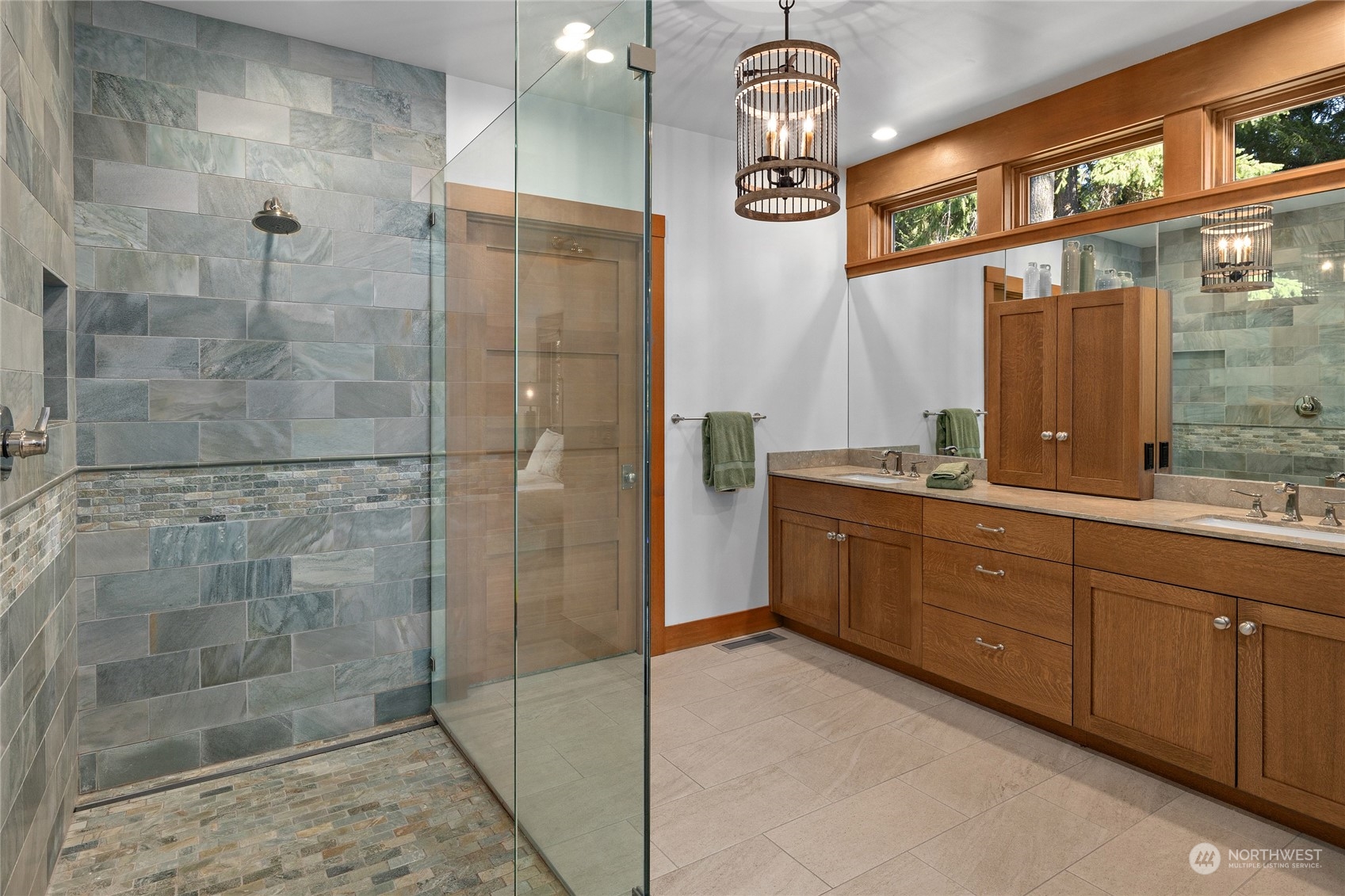 1040 Pinegrass Loop Cle Elum, WA 98922 - Photo 22 of 39 a bathroom with a double vanity sink a toilet a mirror and shower