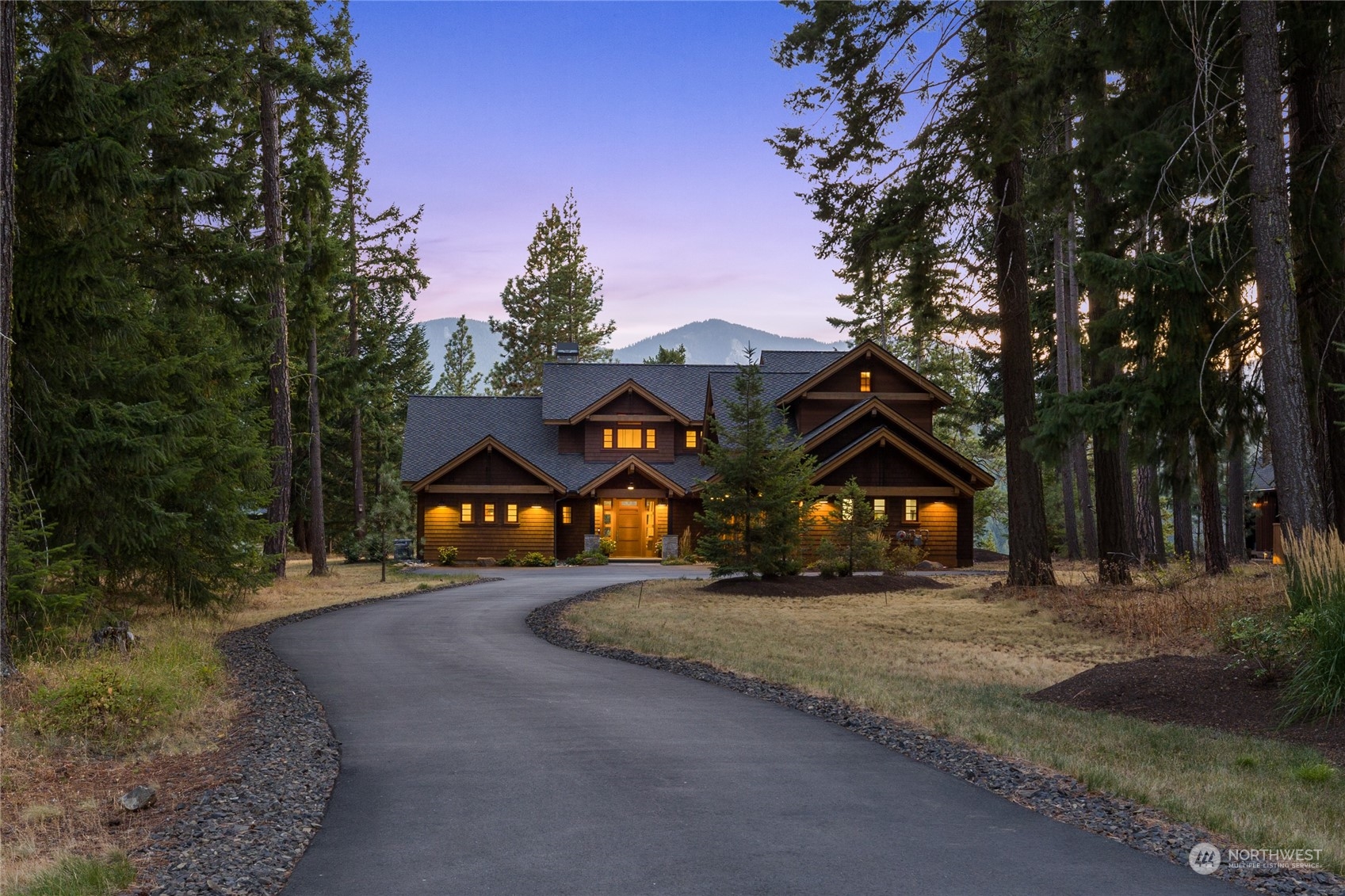 1040 Pinegrass Loop Cle Elum, WA 98922 - Photo 37 of 39 a front view of a house with a yard and garage
