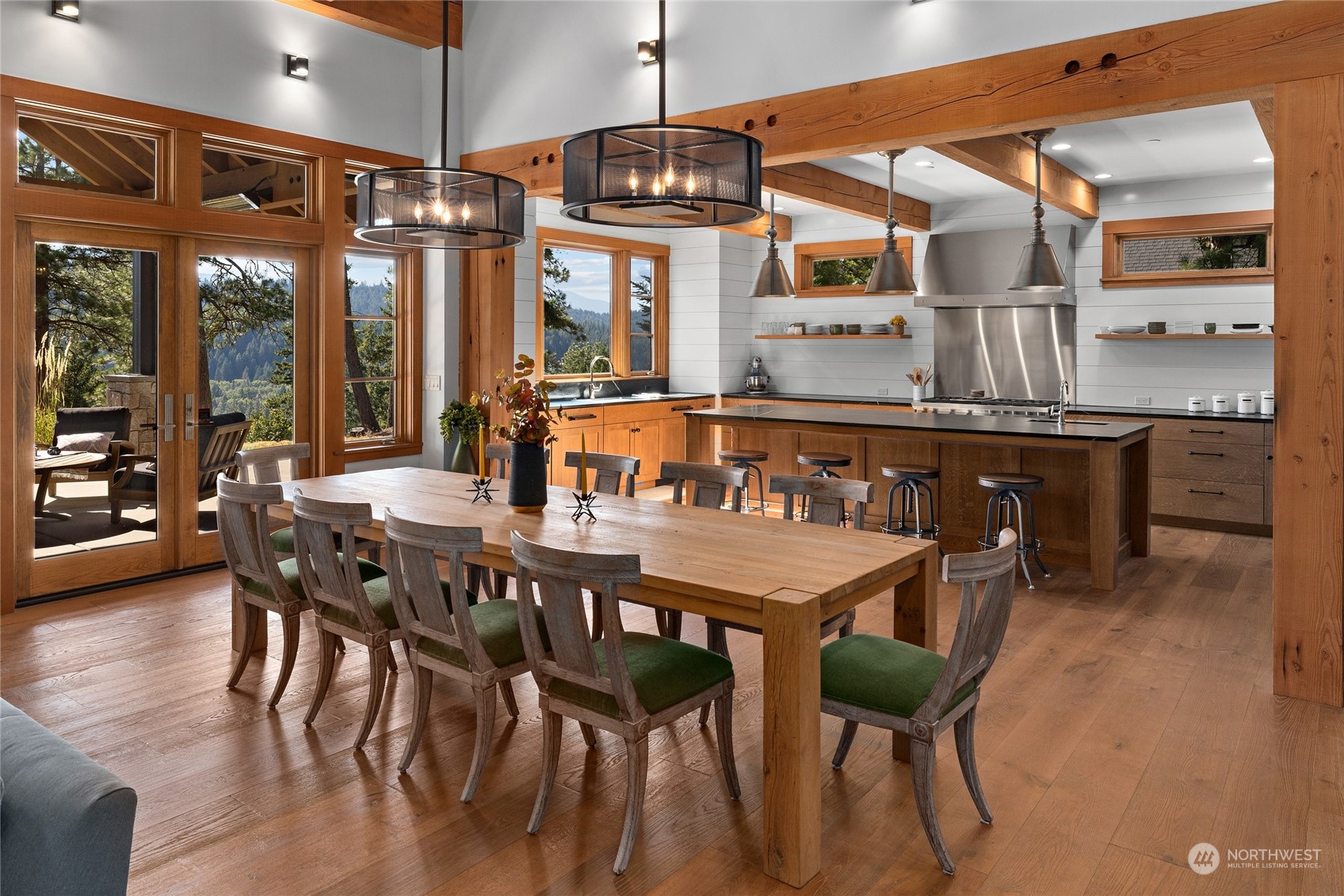 1040 Pinegrass Loop Cle Elum, WA 98922 - Photo 7 of 39 a dining area with a table chairs and a wooden floor