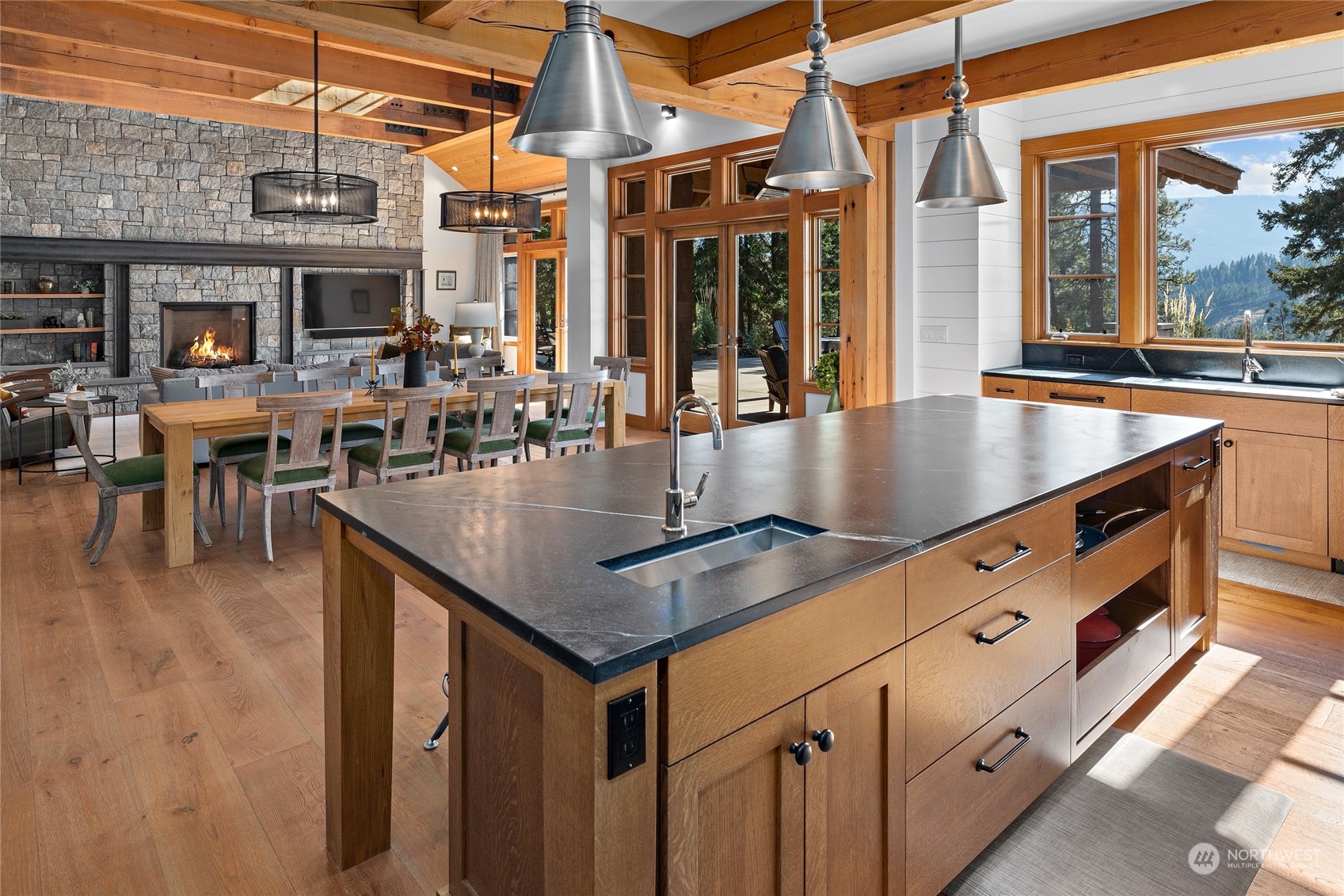 1040 Pinegrass Loop Cle Elum, WA 98922 - Photo 10 of 39 a kitchen with stainless steel appliances granite countertop a sink a counter top space and dining table