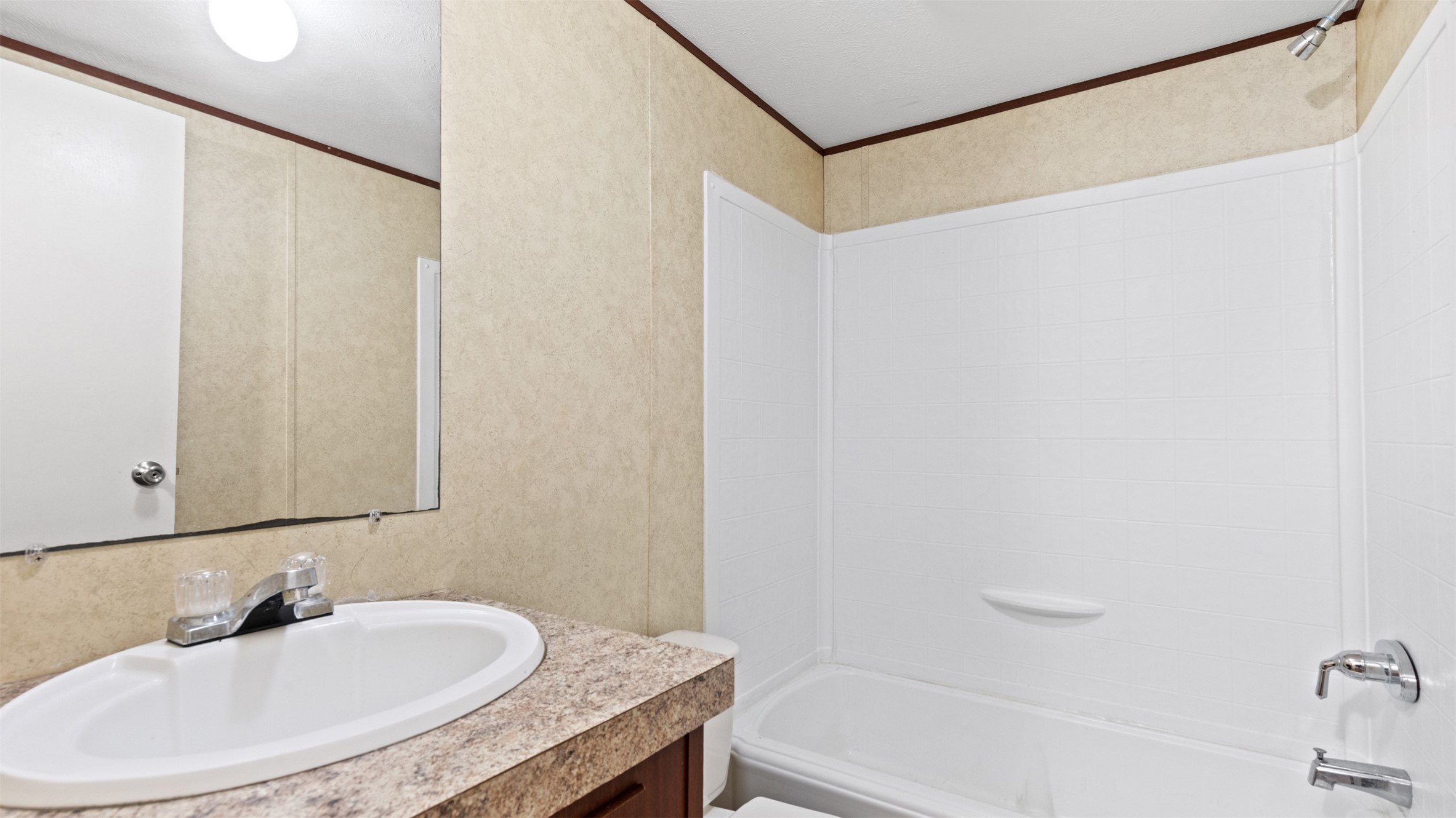 91 Maple Lane Shepherd, TX 77371 - Photo 10 of 15 a bathroom with a granite countertop sink and a mirror