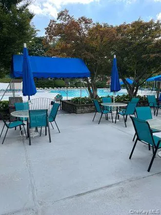 a living room with couches and a flat screen tv