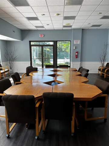a view of a balcony and floor to ceiling windows