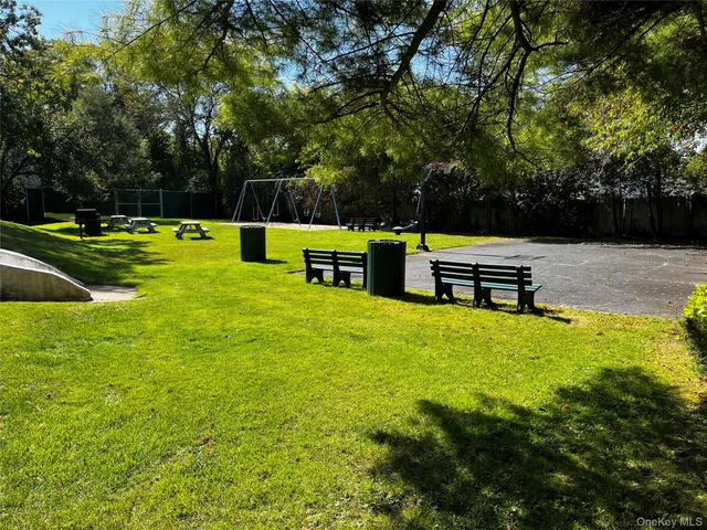 a view of a park with large trees