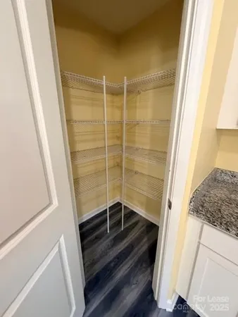 a bathroom with a shower and a sink