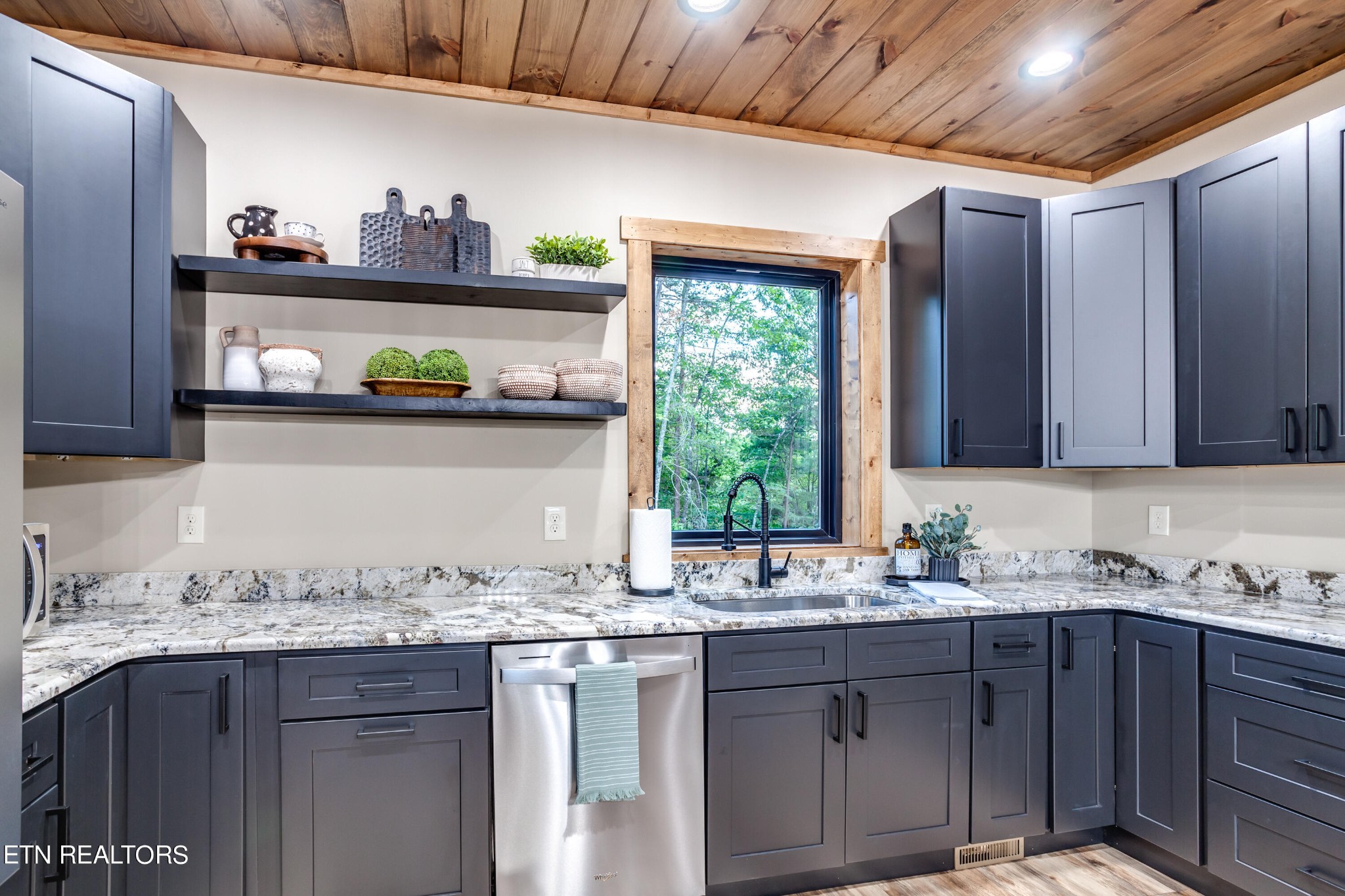 1820 High View Court Sevierville, TN 37876 - Photo 14 of 58 a kitchen with granite countertop stainless steel appliances sink cabinets and window