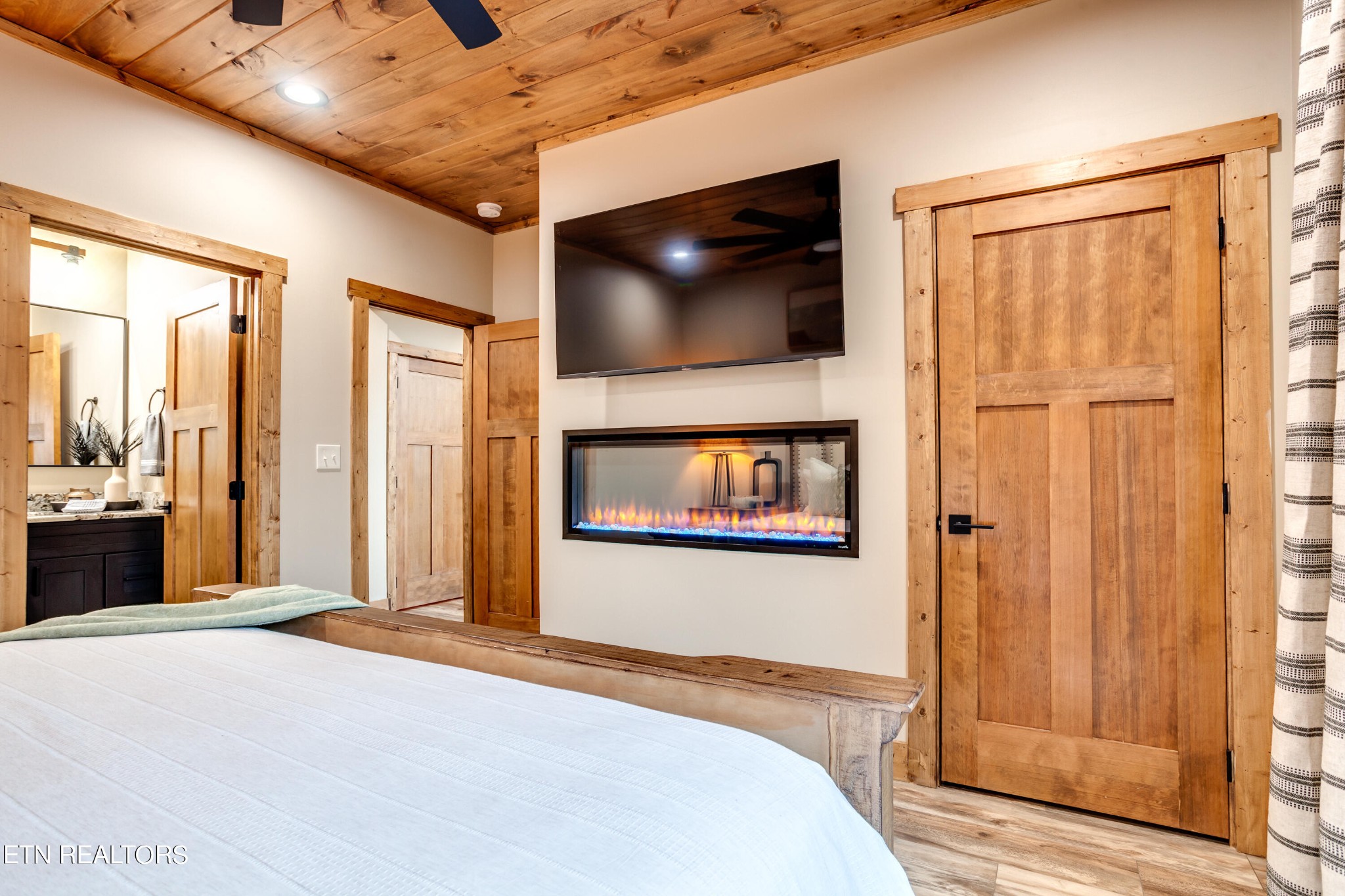 1820 High View Court Sevierville, TN 37876 - Photo 22 of 58 a bedroom with a bed and a flat screen tv