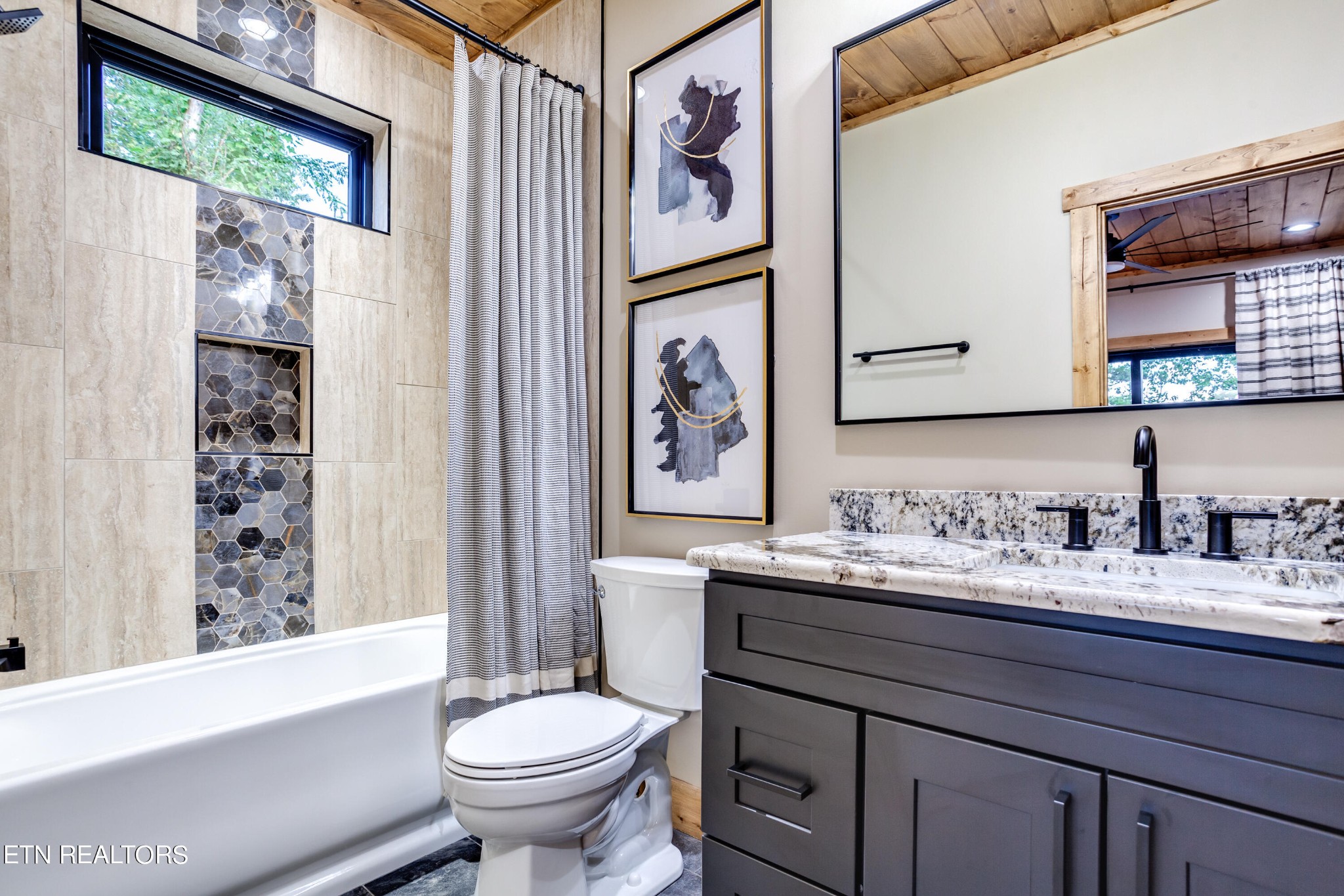 1820 High View Court Sevierville, TN 37876 - Photo 23 of 58 a bathroom with a granite countertop sink toilet and a large mirror