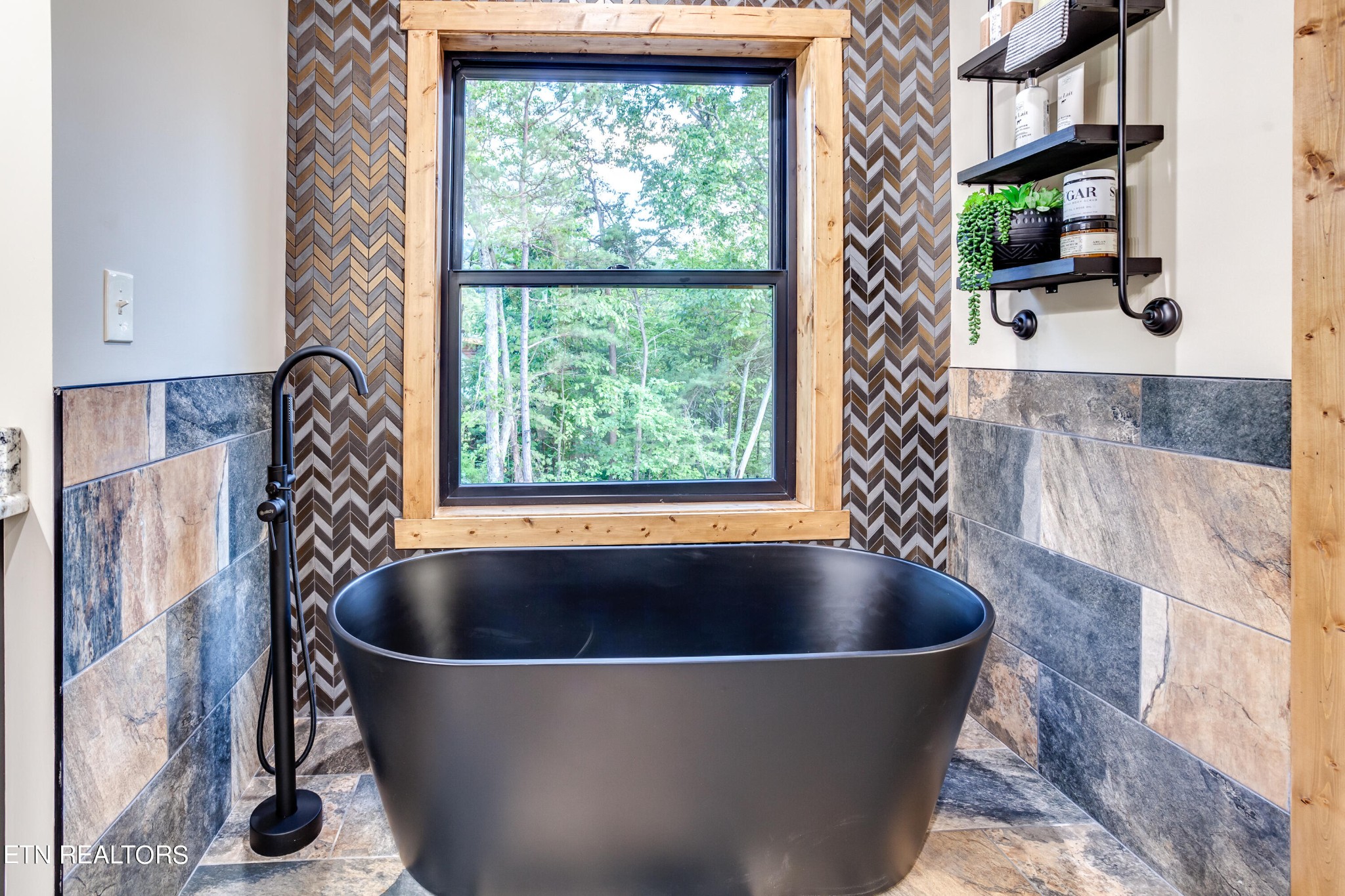1820 High View Court Sevierville, TN 37876 - Photo 36 of 58 a bath tub sitting in a bathroom next to a window