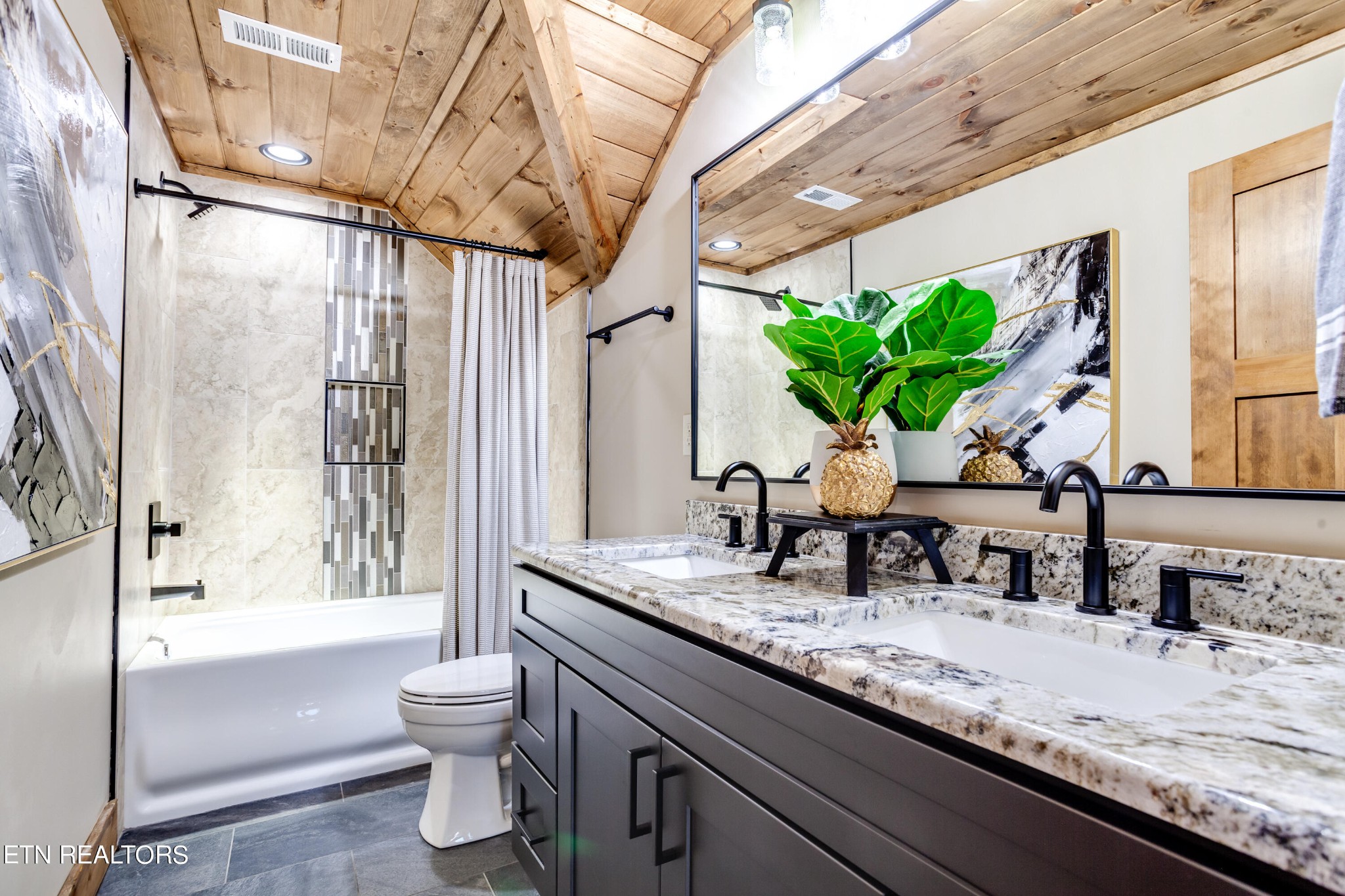 1820 High View Court Sevierville, TN 37876 - Photo 39 of 58 a bathroom with a granite countertop sink a toilet a mirror and shower
