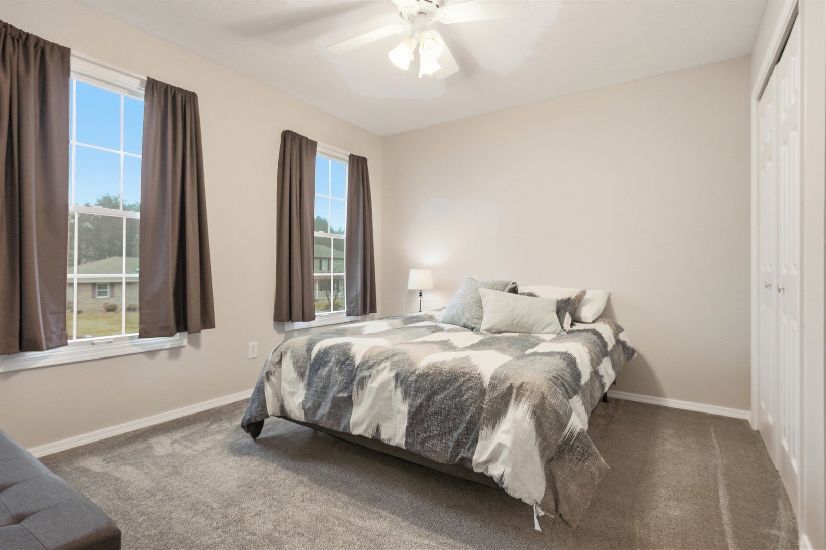 811 Landau Lane Normal, IL 61761 - Photo 13 of 34 a bed sitting in a bedroom next to a window