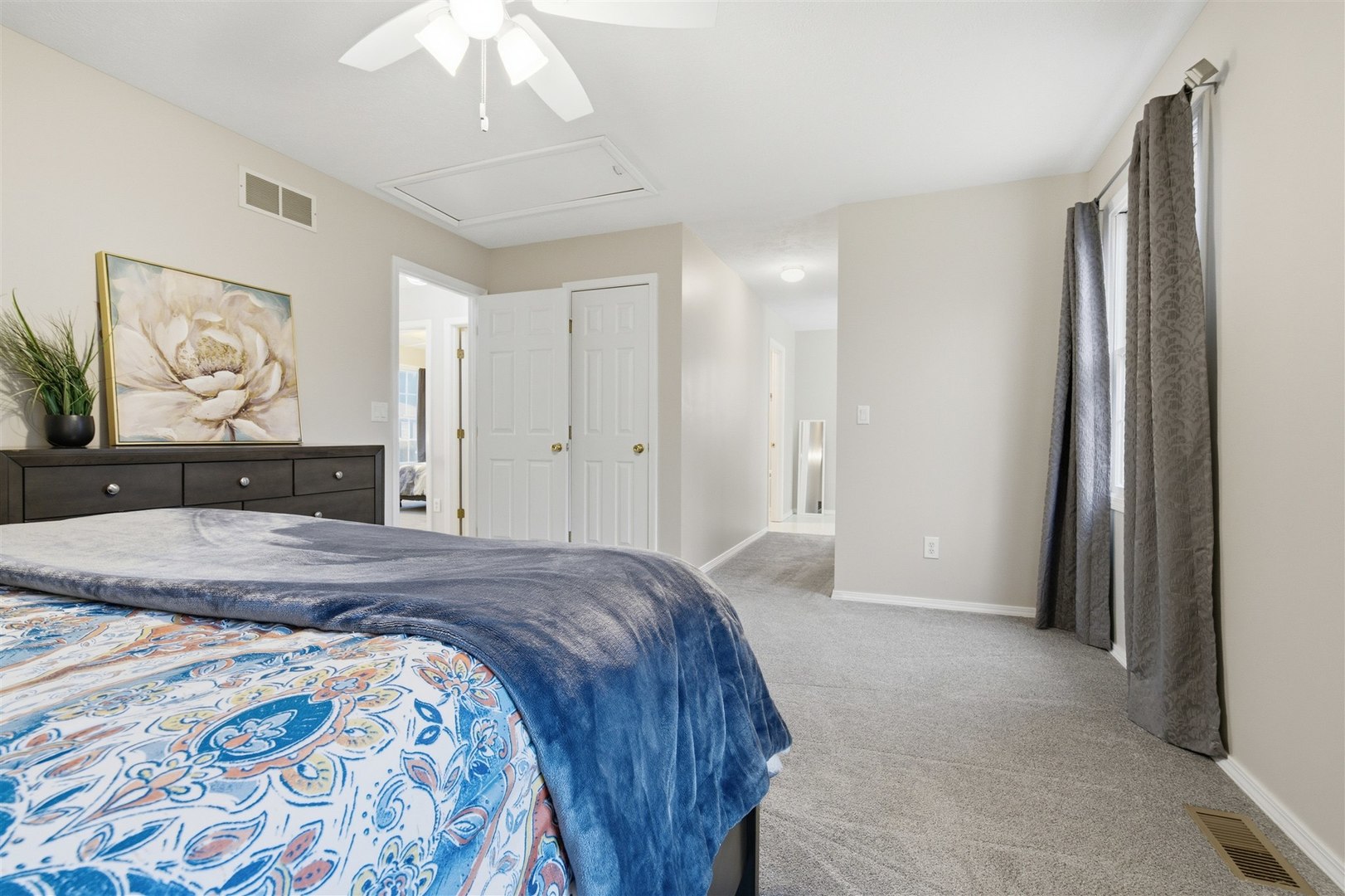 811 Landau Lane Normal, IL 61761 - Photo 16 of 34 a spacious bedroom with a bed and a dresser
