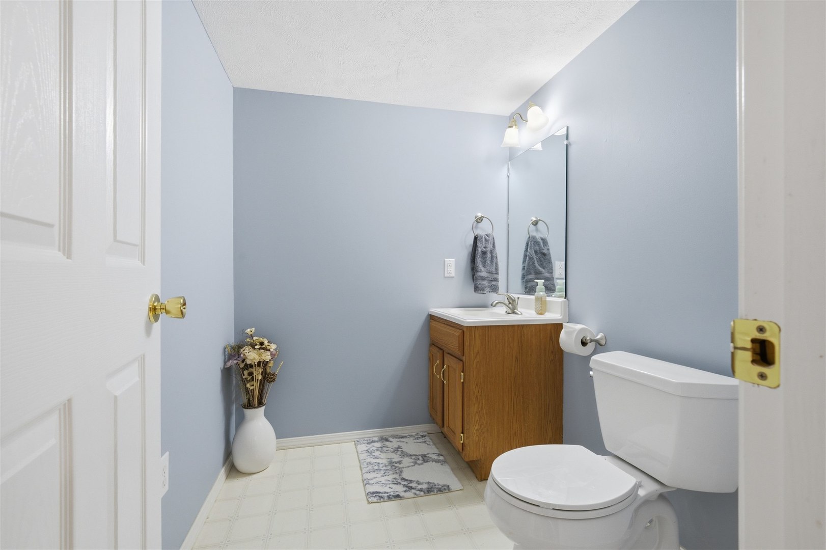 811 Landau Lane Normal, IL 61761 - Photo 21 of 34 a bathroom with a toilet sink and mirror