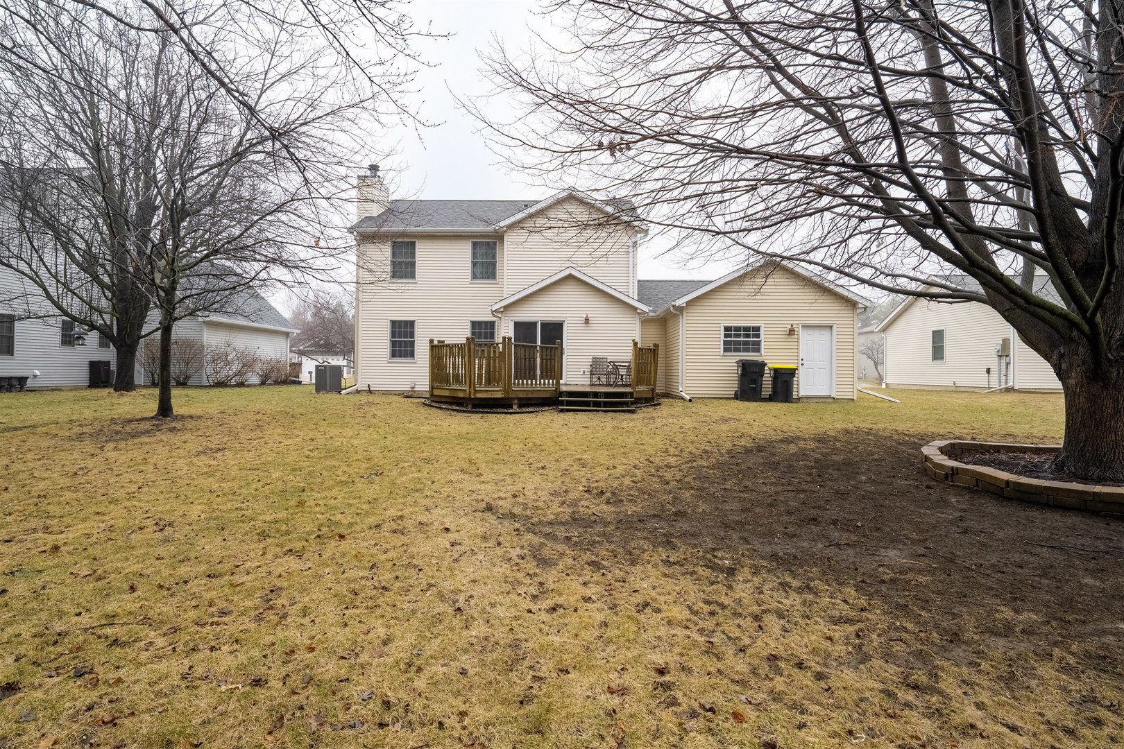 811 Landau Lane Normal, IL 61761 - Photo 32 of 34 a front view of a house with a yard covered with snow
