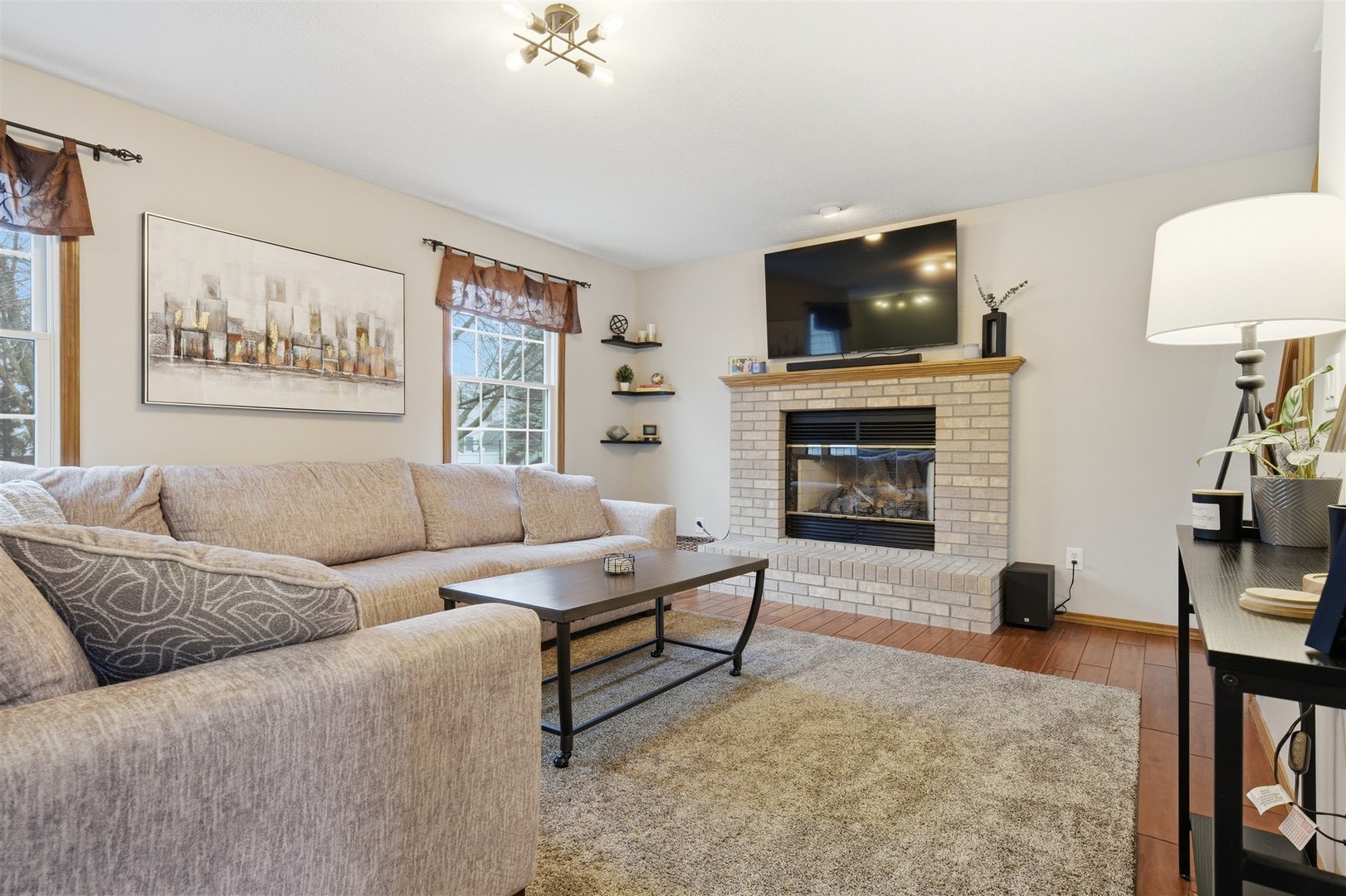 811 Landau Lane Normal, IL 61761 - Photo 7 of 34 a living room with furniture and a flat screen tv