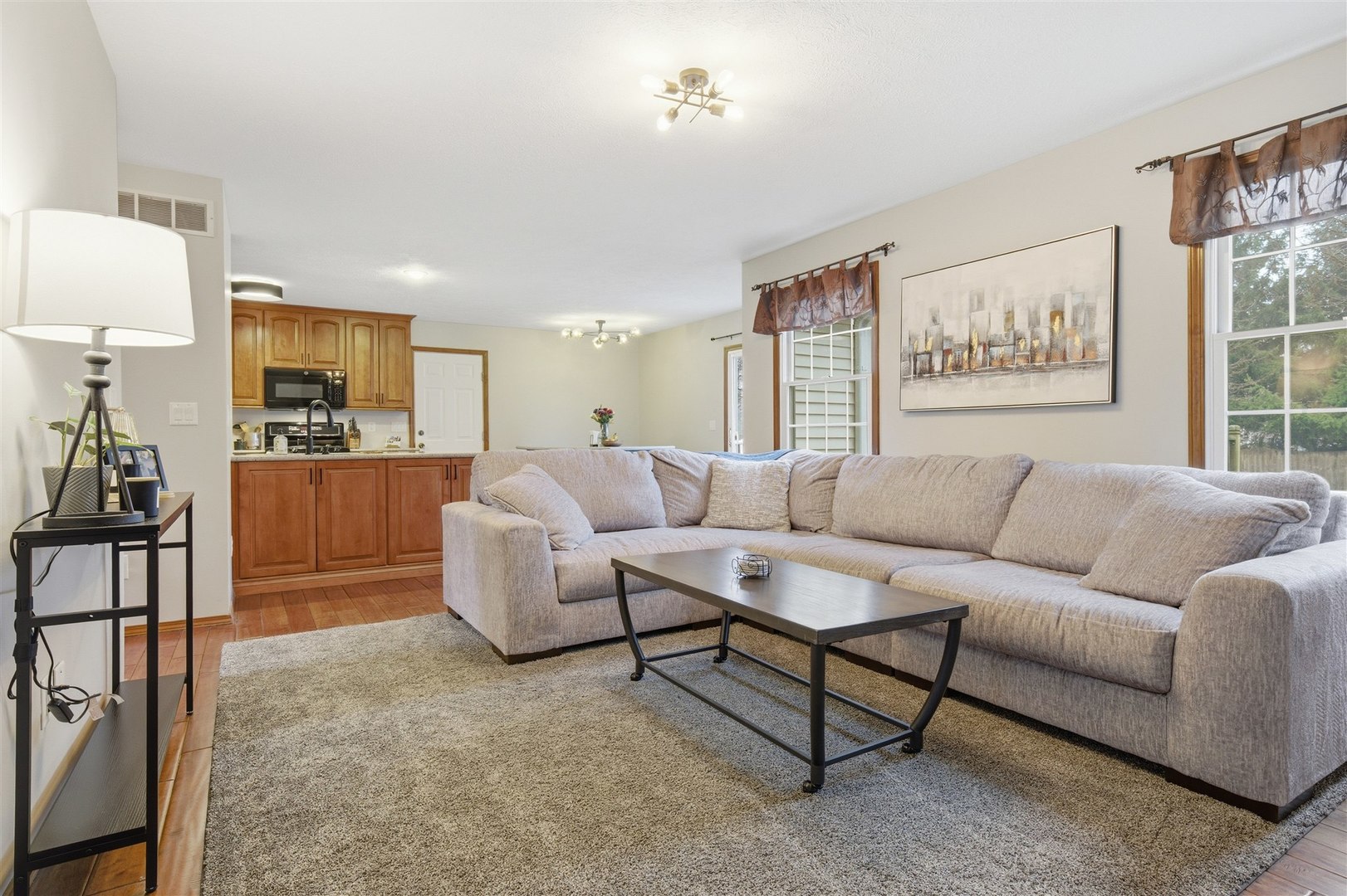 811 Landau Lane Normal, IL 61761 - Photo 8 of 34 a living room with furniture and a flat screen tv