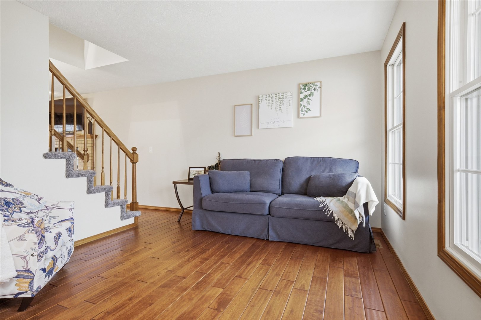 811 Landau Lane Normal, IL 61761 - Photo 10 of 34 a living room with furniture and a wooden floor