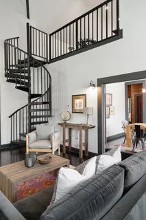 a bed room with furniture and wooden floor